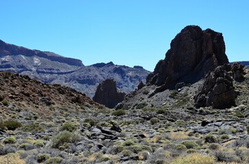 Scenic view of volcanic rock formations in desert during sunny day, Teide National Park, Tenerife