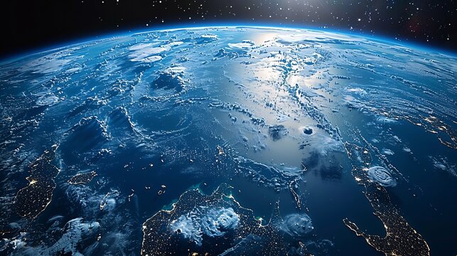 view of Earth from space with clouds and illuminated 