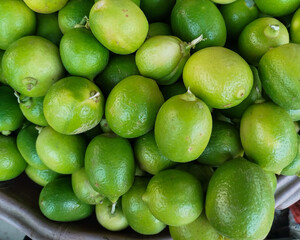 fresh limes and lemon on the market
