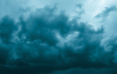 Sky with waves of dark teal and deep blue clouds