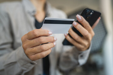 Adult woman use smart phone for online shopping transaction safely