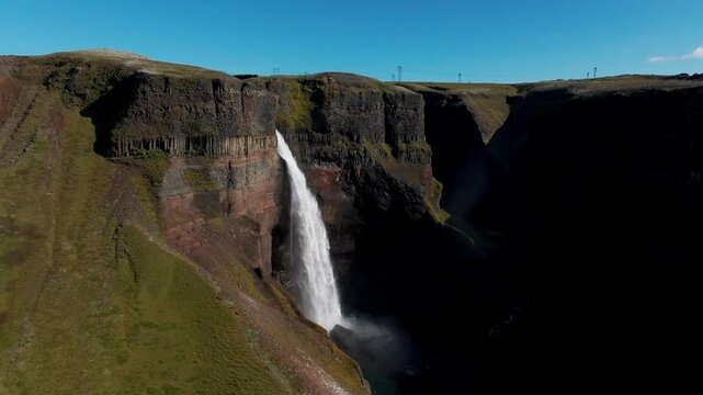 Haifoss Waterfall On A Sunny Summer Day In Southern Iceland. - aerial pullback shot