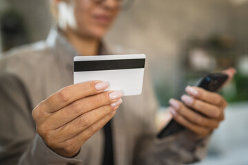Adult woman use smart phone for online shopping transaction safely