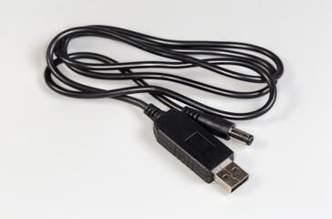 Power cable-adapter with USB and coaxial connectors on edges