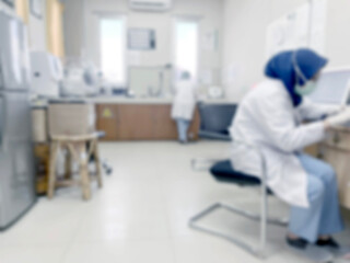 Blurred of laboratory hospital or clinical with people - abstract medical background.