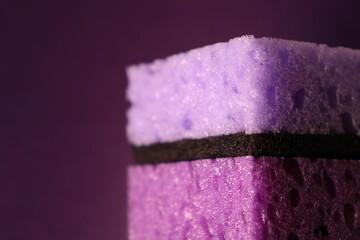 stylish dark sponges for washing dishes and cleaning on a purple background