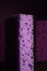 stylish dark sponges for washing dishes and cleaning on a purple background