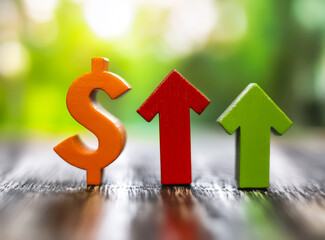 Wooden figures on a wooden surface with a blurred green background. The dollar symbol and upward arrows symbolize financial growth and value increase.