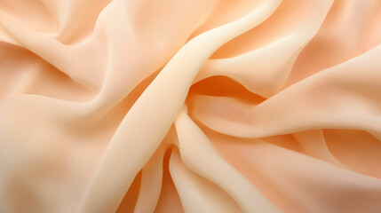 Obraz premium Soft, flowing fabric background in gentle peach tones, perfect for design projects and textile presentations.