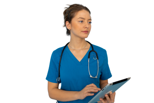 Young nurse in scrubs efficiently using a tablet for patient care