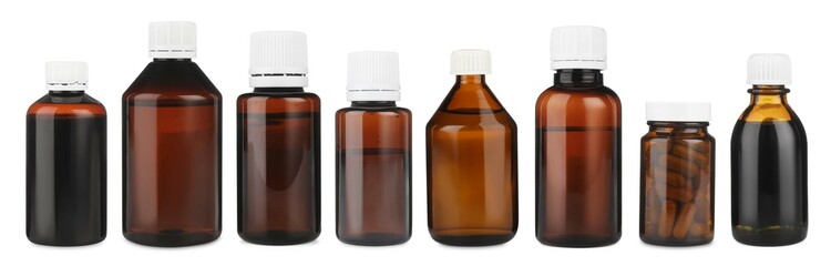 Many different glass bottles isolated on white