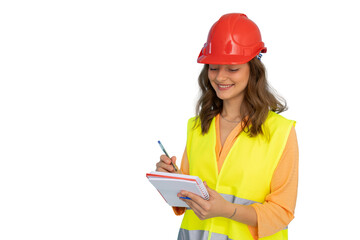 Ambitious young woman in hard hat focused on her work