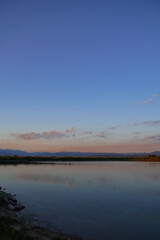 Fototapeta premium Belizmata Dam with a backdrop of the Pirin Mountains, Bansko, Bulgaria