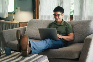 asian man work using computer hand typing laptop keyboard contact us.student study learning education online.adult professional people chatting search at office.concept for technology device business.