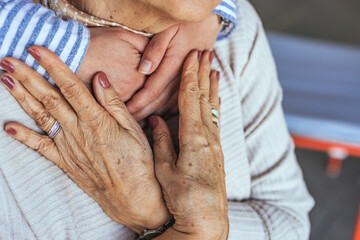 Close-Up of Elderly Hands Embracing a Loved One