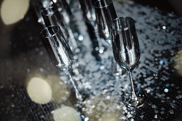 silver glasses of champagne. confetti holidays concept