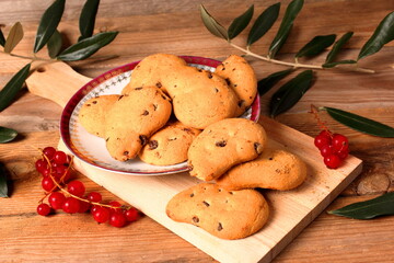 Christmas cookies on a plate with spices. Tasty cookies with dark chocolate chips.