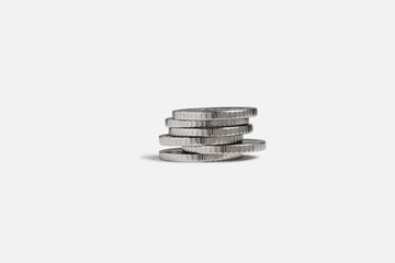 a stack of coins lies on a white background. financial pyramid