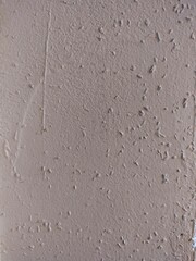 Lightly textured white wall surface