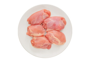 Boneless chicken thighs in plate. Isolated in white background. Raw chicken meat for cooking....
