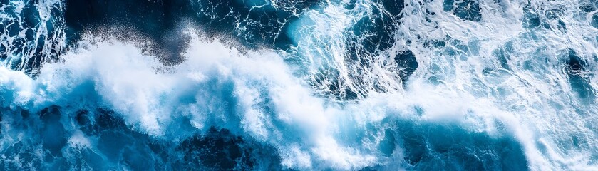 Aerial View of Ocean Waves Crashing and Forming White Foam