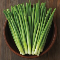 Obraz premium A bowl filled with fresh green onions, showcasing their vibrant color.