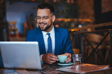 Young Professional Enjoying Coffee Break in Modern Cafe