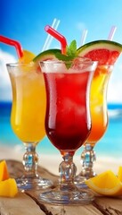 Three Refreshing Fruit Cocktails on a Tropical Beach with Blue Sky, Sand, and Sliced Fruit