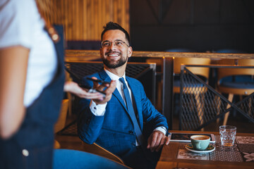 Business Meeting in a Modern Cafe with Coffee and Smiles