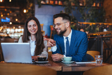 Colleagues Enjoying Productive Meeting in Cozy Café Setting