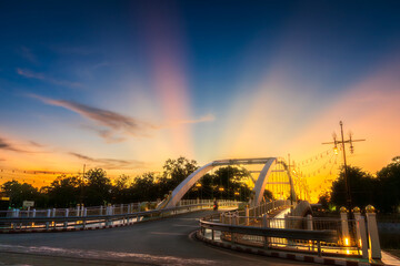 light Bridge over the Nan River (Wat Phra Si Rattana Mahathat also - Chan Palace) New Landmark It is a major tourist is Public places attraction Phitsanulok,Thailand.vivid Twilight dramatic sunset.