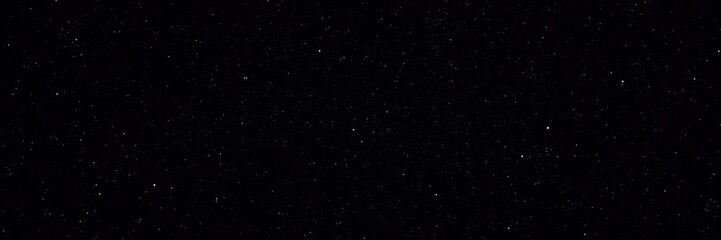 Dark night sky filled with twinkling stars and a sense of vastness, space, black
