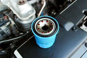 Automotive oil filter on engine bay , Car maintenance concept