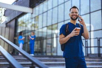 Smiling Healthcare Professional Talking on Phone Outside Hospital
