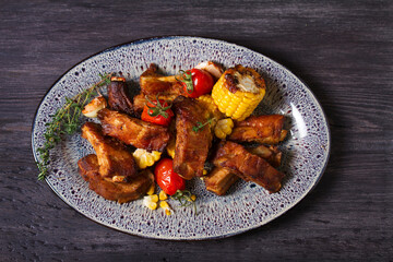 Slow cooked pork spare ribs in a barbecue sauce. View from above, top studio shot