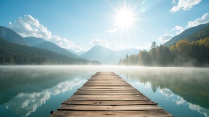 A wooden pier is leading into the misty lake