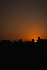 silhouette of a person at sunset