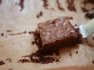 Enjoy a freshly baked homemade chocolate brownie, with a moist and fudgy texture, perfectly served for a special Christmas or Valentine's Day celebration.