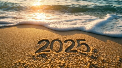 Year 2025 Written in Sand at Sunrise