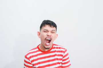 portrait of an asian young man showing shocked expression