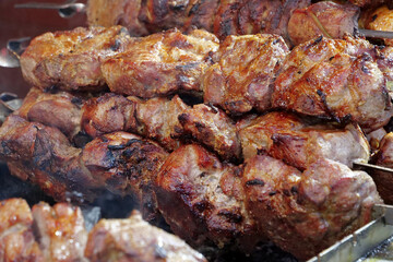 Delicious hot kebabs. Shish kebabs broils in barbecue