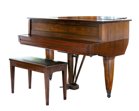 A traditional spinet piano crafted from wood, accompanied by a matching bench. The piano features a compact design, a polished and warm wood finish, tapered legs, and a closed top.