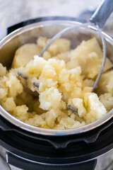 Whipping Up Creamy Mashed Potatoes in Modern Kitchen