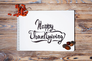 Thanksgiving Greeting on Notebook with Rustic Wooden Background