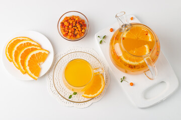 Sea buckthorn tea drink with oranges and mint. Autumn comfort hot drink. Herbal vitamin tea. 