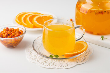 Sea buckthorn tea drink with oranges and mint. Autumn comfort hot drink. Herbal vitamin tea. 