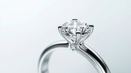 Elegant white gold engagement ring from a luxury collection, isolated on a clean white background with ample copy space for design elements. A stunning display of sophistication and charm.