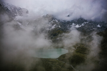 A beautiful lake placed between the Alps, a majestic landscape in the mountains.