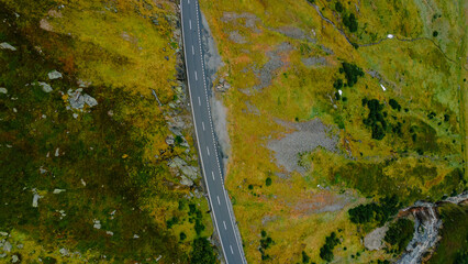 A beautiful road in the mountains, a landscape of a road that crosses the Alps.