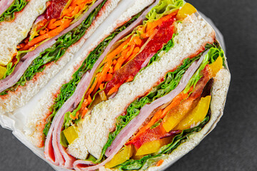 sandwich layers vegetables and ham meat spam fresh meal food snack on the table copy space food...